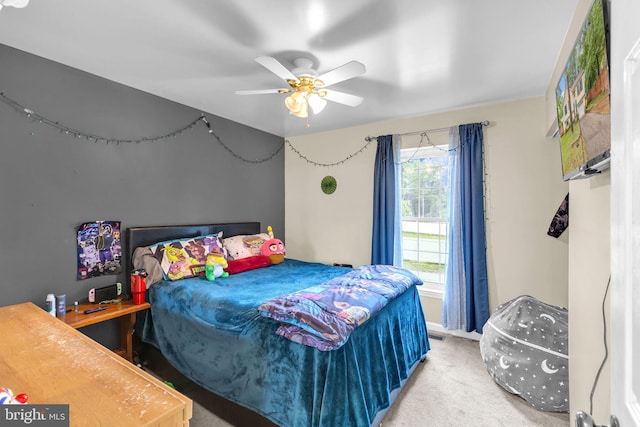 bedroom featuring carpet flooring, baseboards, and a ceiling fan