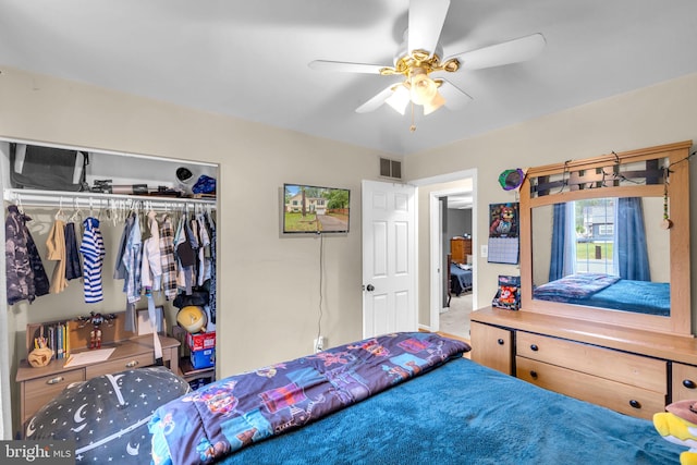 bedroom with a closet and a ceiling fan