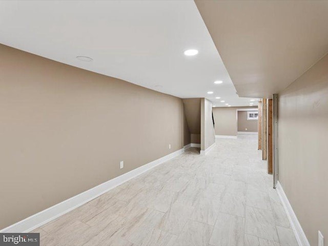 finished below grade area with recessed lighting and baseboards