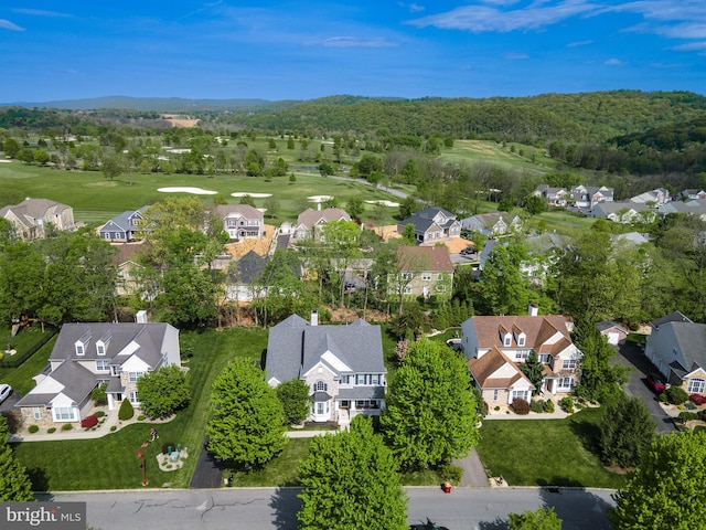 aerial overview of property's location featuring nearby suburban area and a golf club