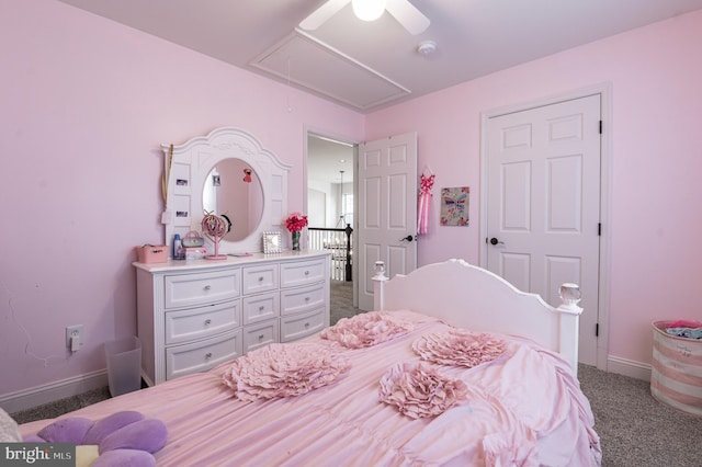 bedroom featuring attic access, carpet flooring, baseboards, and ceiling fan