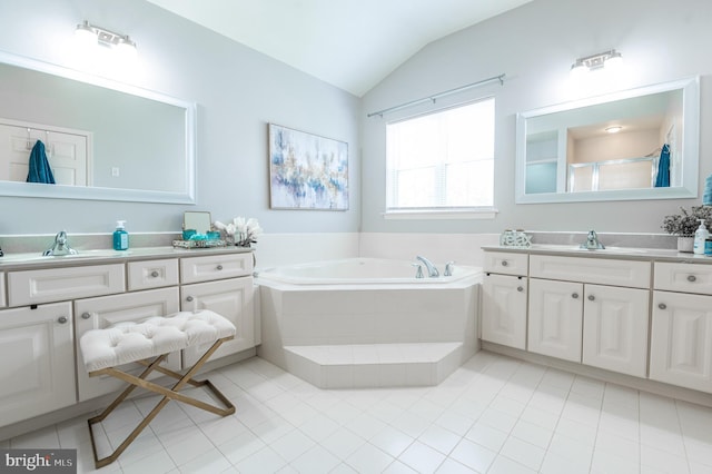 full bathroom featuring vaulted ceiling, a garden tub, tile patterned flooring, vanity, and a shower