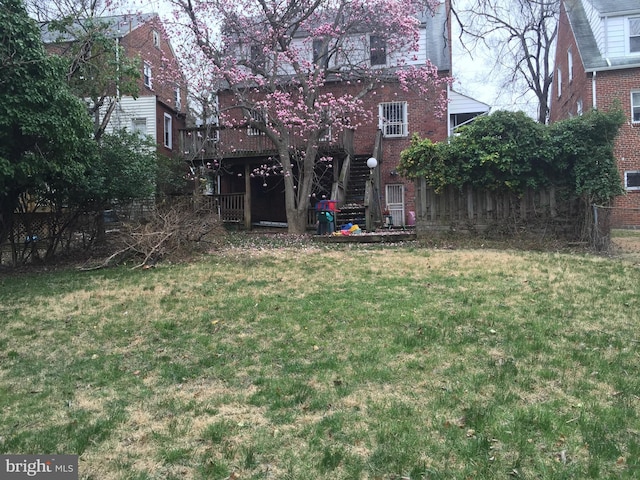 view of yard with a wooden deck