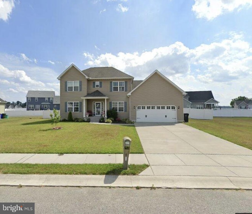 view of front of house featuring concrete driveway and a garage