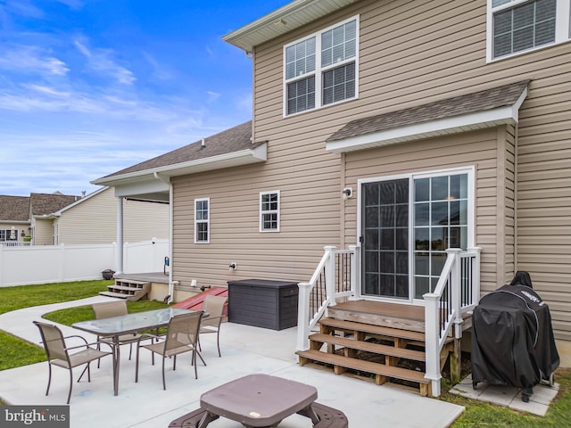 166 Spring Dale Ln, Felton, DE 19943 - rear view of house featuring a patio area, entry steps, outdoor dining area, and a shingled roof