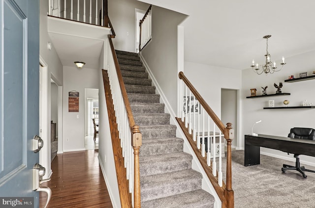 166 Spring Dale Ln, Felton, DE 19943 - foyer entrance featuring a chandelier, stairway, baseboards, and wood finished floors