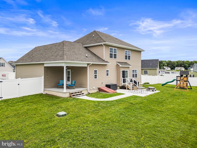 166 Spring Dale Ln, Felton, DE 19943 - back of property with a patio area, a playground, roof with shingles, and a deck