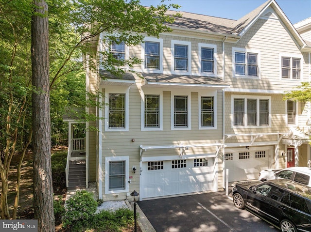 11956 Majestic Prince Ln Unit 101, Berlin, MD 21811 - multi unit property with a garage, asphalt driveway, and roof with shingles