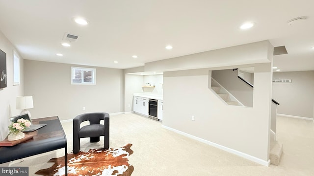 living area featuring beverage cooler, light carpet, recessed lighting, stairway, and baseboards