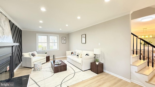 living area featuring wood finished floors, stairs, ornamental molding, baseboards, and recessed lighting