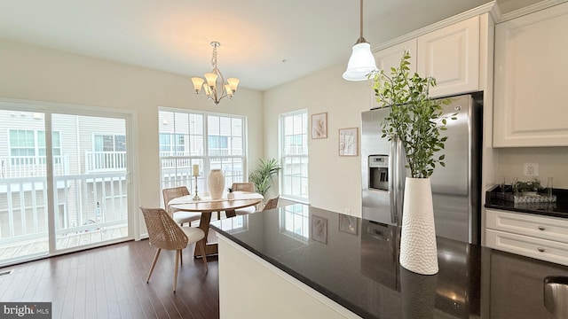 12515 Rustic Rock Ln, Beltsville, MD 20705 - kitchen featuring stainless steel fridge with ice dispenser, dark countertops, dark wood-style floors, a chandelier, and white cabinets