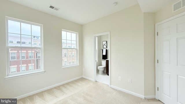 12515 Rustic Rock Ln, Beltsville, MD 20705 - unfurnished bedroom with baseboards, light colored carpet, and ensuite bath