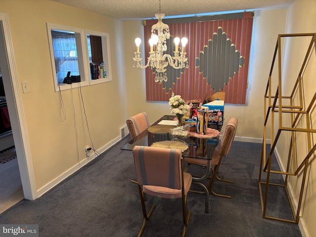 carpeted dining room with a chandelier, a textured ceiling, and baseboards