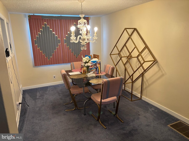 dining area with a chandelier, a textured ceiling, and carpet