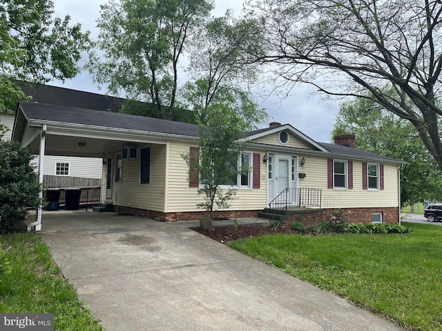 ranch-style home with driveway, a chimney, a front lawn, and an attached carport