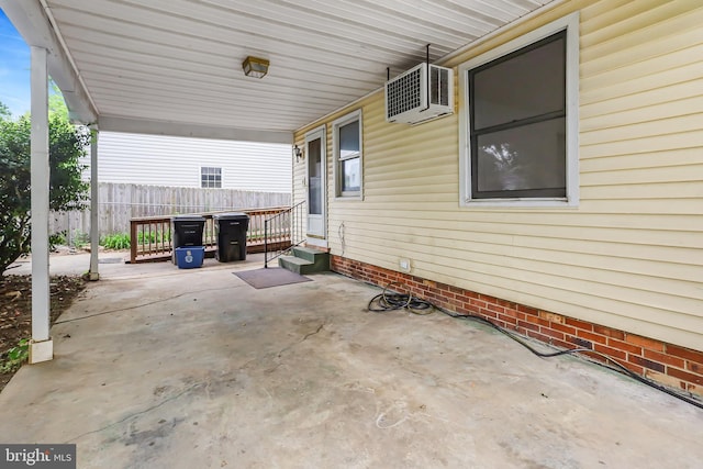 view of patio featuring entry steps and fence