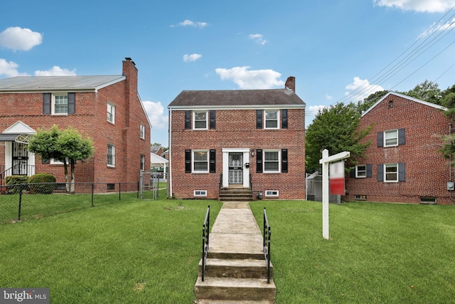 4850 Eastern Ave NE, Washington, DC 20017 - colonial house featuring a chimney and brick siding