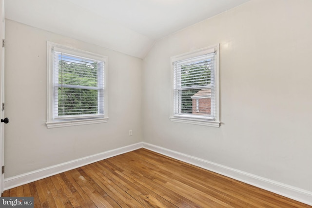 4850 Eastern Ave NE, Washington, DC 20017 - spare room featuring healthy amount of natural light, lofted ceiling, baseboards, and hardwood / wood-style floors