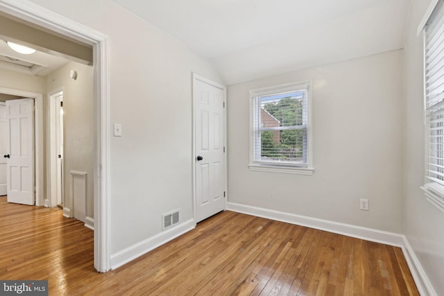 4850 Eastern Ave NE, Washington, DC 20017 - unfurnished bedroom with light wood finished floors, baseboards, and lofted ceiling