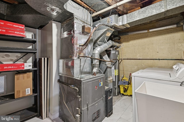 4850 Eastern Ave NE, Washington, DC 20017 - utilities with a sink, independent washer and dryer, and gas water heater