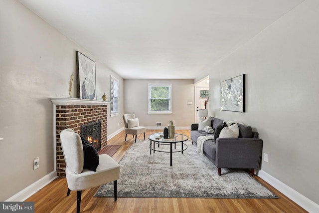 4850 Eastern Ave NE, Washington, DC 20017 - living area featuring wood finished floors, a fireplace, and baseboards