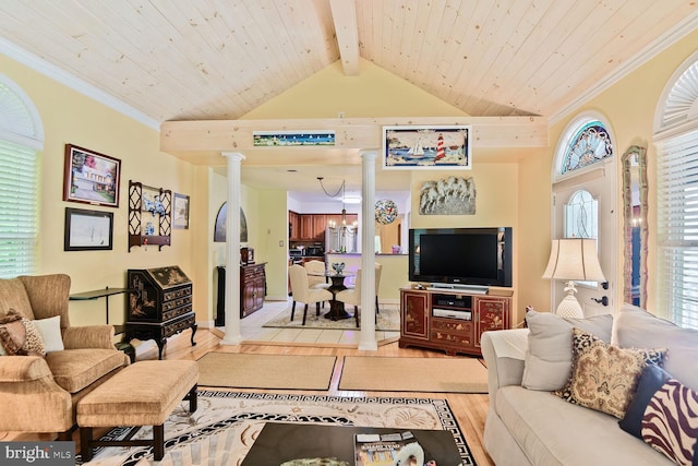 living room with decorative columns, light wood finished floors, beamed ceiling, wood ceiling, and crown molding