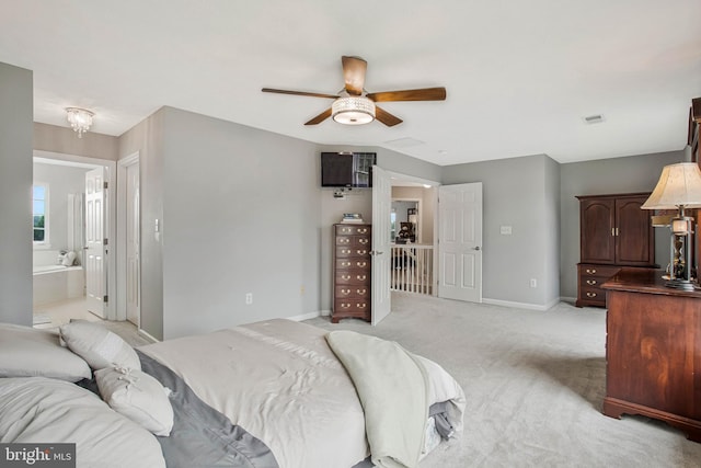 455 Creeks End Ln, Stevensville, MD 21666 - bedroom with light colored carpet, baseboards, connected bathroom, and a ceiling fan