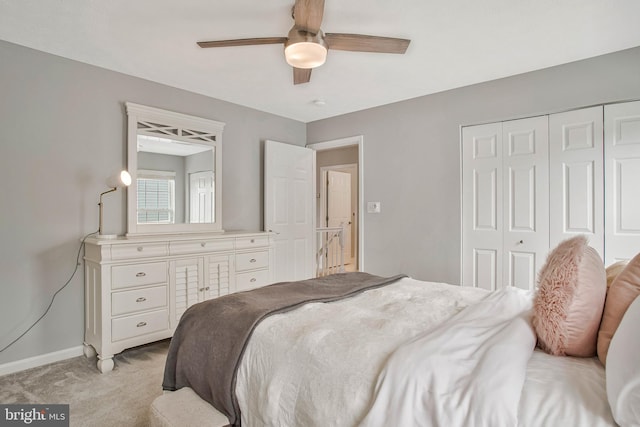 455 Creeks End Ln, Stevensville, MD 21666 - bedroom featuring light colored carpet, a closet, baseboards, and ceiling fan