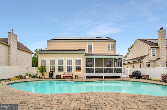 455 Creeks End Ln, Stevensville, MD 21666 - view of pool with a sunroom and a fenced backyard
