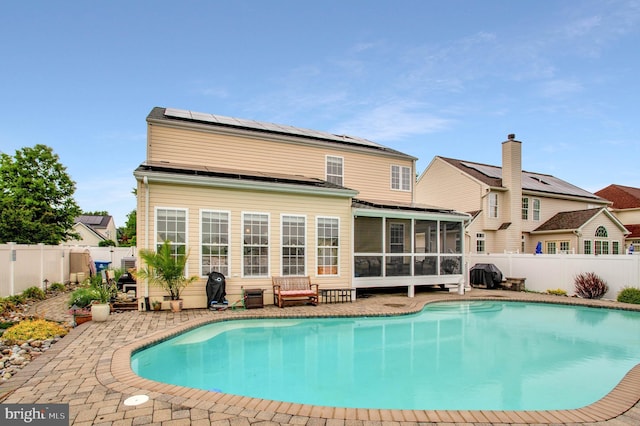455 Creeks End Ln, Stevensville, MD 21666 - view of swimming pool with a sunroom, a fenced backyard, and a patio area