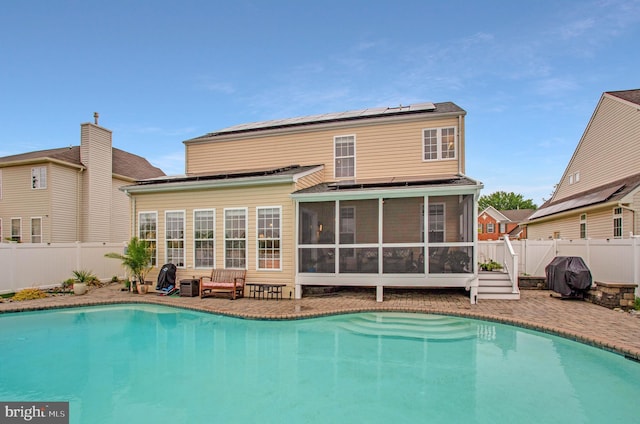 455 Creeks End Ln, Stevensville, MD 21666 - view of pool with a sunroom and a fenced backyard