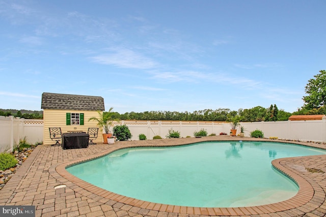 455 Creeks End Ln, Stevensville, MD 21666 - view of swimming pool with a fenced backyard, an outbuilding, and a patio