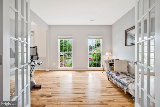 455 Creeks End Ln, Stevensville, MD 21666 - living area featuring french doors, light wood-style floors, and baseboards
