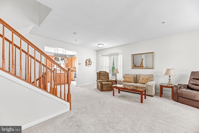 living area with stairs, carpet flooring, and baseboards
