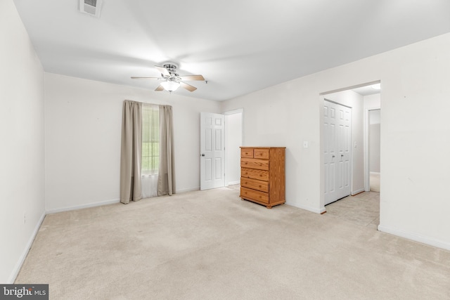 unfurnished bedroom with carpet floors, baseboards, and ceiling fan