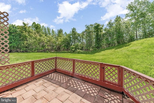 deck featuring a yard and a patio