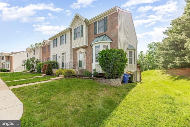 view of front of house with a front lawn and a residential view
