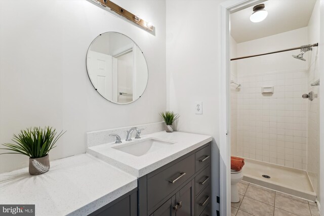 10903 Pebble Run Dr, Silver Spring, MD 20902 - full bath with tile patterned flooring, vanity, toilet, and a shower stall