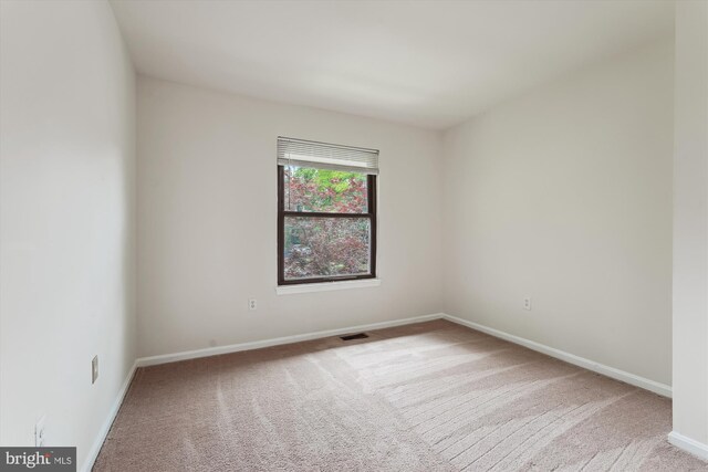 10903 Pebble Run Dr, Silver Spring, MD 20902 - spare room featuring carpet flooring and baseboards