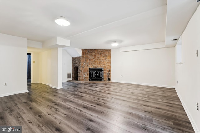 10903 Pebble Run Dr, Silver Spring, MD 20902 - unfurnished living room with wood finished floors, a fireplace, and baseboards