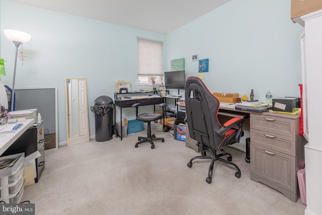 office space with light carpet and baseboards