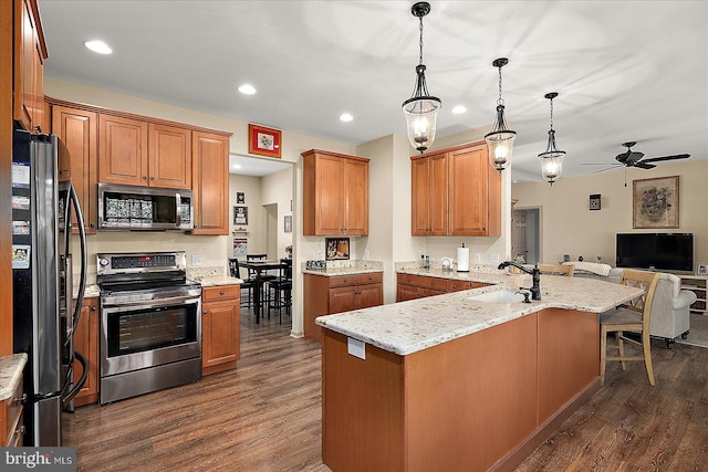 119 Mumfords Landing Rd, Ocean Pines, MD 21811 - kitchen featuring appliances with stainless steel finishes, a sink, dark wood finished floors, open floor plan, and ceiling fan