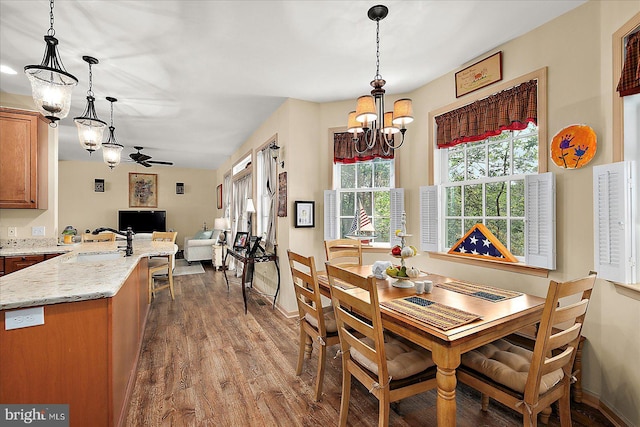 119 Mumfords Landing Rd, Ocean Pines, MD 21811 - dining area with wood finished floors, a chandelier, ceiling fan, and baseboards