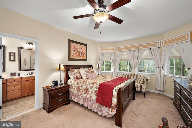 119 Mumfords Landing Rd, Ocean Pines, MD 21811 - bedroom with light carpet, baseboards, ensuite bathroom, and ceiling fan