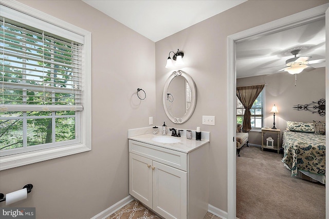 119 Mumfords Landing Rd, Ocean Pines, MD 21811 - ensuite bathroom featuring vanity, ceiling fan, and baseboards
