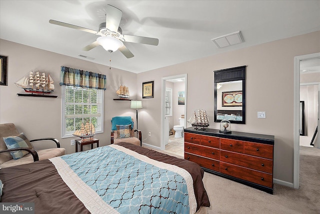 119 Mumfords Landing Rd, Ocean Pines, MD 21811 - bedroom with light carpet, baseboards, ensuite bath, and a ceiling fan