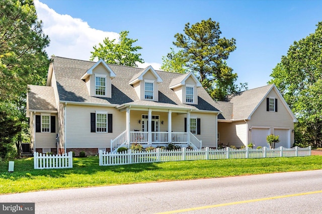 119 Mumfords Landing Rd, Ocean Pines, MD 21811 - cape cod-style house with covered porch, a garage, and roof with shingles