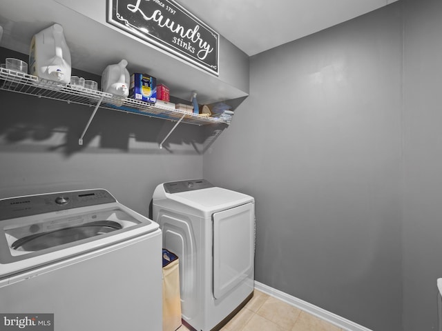 1422 Silver Oak Ln, Arnold, MD 21012 - laundry room with independent washer and dryer, light tile patterned flooring, and baseboards