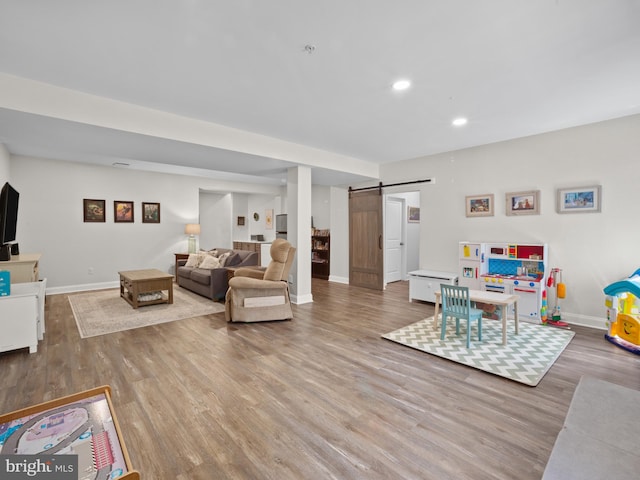 1422 Silver Oak Ln, Arnold, MD 21012 - living area with a barn door, wood finished floors, baseboards, and recessed lighting