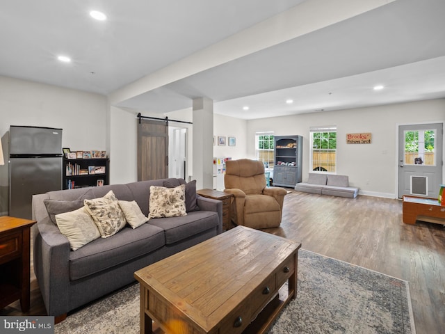 1422 Silver Oak Ln, Arnold, MD 21012 - living area with a barn door, wood finished floors, recessed lighting, and baseboards